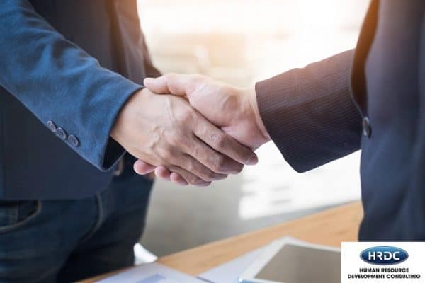 Two Confident Business Man Shaking Hands During A Meeting In The